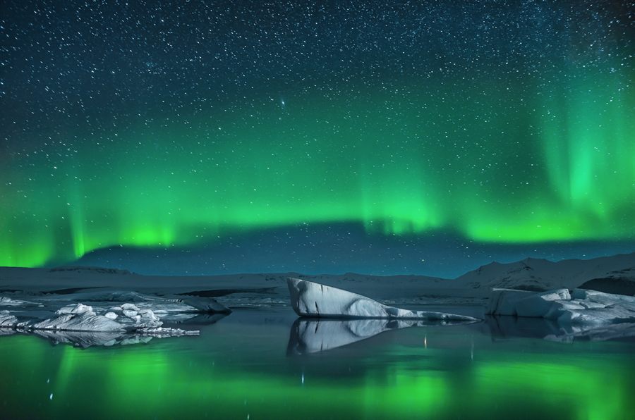 Aurora over icy water